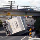 The truck rolled onto a passing vehicle in Humber St, under the overbridge. Photo: Rebecca Ryan