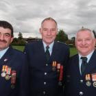 Arrowtown Fire Brigade Gold Star recipient Mark Woodham (centre) with colleagues Greg Potter ...