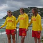 Watching the surf at St Clair beach are (from left) lifeguard Imogen Doyle, Surf Life Saving New...