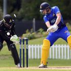 Otago Volts batsman Mitch Renwick is bowled by Malcolm Nofal under the eyes of Wellington...
