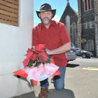 Anthony Odering places flowers in Stafford St, Dunedin, where he was involved in a fatal 
...