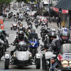 Motorcyclists enter the Octagon as part of the Bronz Otago toy run.
