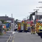 Firefighters at the scene in South Dunedin this evening. Photo: Peter McIntosh