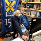 University of Otago chief operating officer Stephen Willis works from home with his son, Alby (2)...