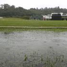 Rain puddles at the boundary edge of the University of Otago Oval yesterday, forcing the...