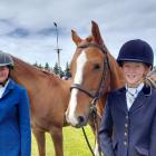 Hannah Thickett (from left) and Sophie Sauer, with horses Luna Eclipse and Griffindor Robinson...