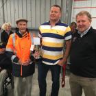 Marlborough farmers Ali (left) and Stu Campbell (centre) are congratulated by the sponsor South...