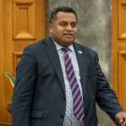 Immigration Minister Kris Faafoi on his way into the House for Question Time, Parliament. Photo:...