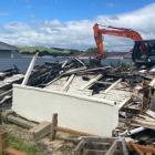 A house in Gore was demolished after being badly damaged by fire on Saturday. PHOTO: JAMES HALL

