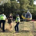 Police discuss extraction tactics with Alexandra helicopter pilot Doug Maxwell. PHOTO: GREGOR...