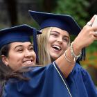 Libby Blore (22, left) and Sarah Thompson (21) celebrate collecting Otago Polytechnic bachelor of...