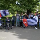 Members of the West Papua Support Dunedin group and supporters fly the Morning Star flag at the...