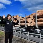 Robert Hoover (14) takes a photograph of a passing truck  on  State Highway 1 at Mosgiel...