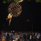 New Year's Eve party-goers in Wanaka watch a fireworks display at midnight. Photo: Tim Miller