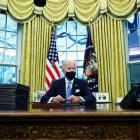 US President Joe Biden signs executive orders in the Oval Office of the White House yesterday....