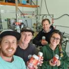 Loose Moose Canning Co owner Wesley McAllister, left, with employees Matthew Ward, Charlotte Hind...