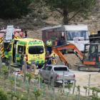 Emergency services and other people work at the scene of a fatal tractor accident yesterday....