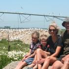 Dairy farmers Ali Van Polanen and Andrew Black with their children Florence and Hudson are happy...