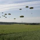 British paratroopers from the 3rd Parachute Battailon, England, land in a wheat field outside the...
