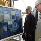 RDS Gallery director Hilary Radner and Alistair Fox, both of Dunedin, admire the winning painting...