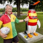 Snow (Ian) Richards beside Snow the penguin, which was designed and named in his honour to...