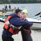 Meg McLaughlan gets a hug from her mother Jo at the end of her epic swim. Photo: Mark Price 