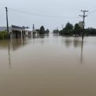 Snow Ave, Middlemarch, with the Tap &amp; Dough Bistro at left, looked more like a river, during...