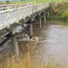 Safety signage was taken from the Channel Rd bridge at Tussock Creek, which was closed due to...