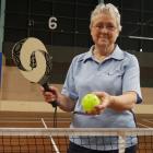 Otago Badminton Association secretary Shirley Woodrow holds the bat and plastic ball used in...