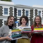 University Book Shop staff members (from left) Rosie Hill, Charlotte McKay and Rebekah Clements...