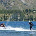 Kelly Gooch demonstrates the newly available activity of foil surfing on Lake Wanaka yesterday....