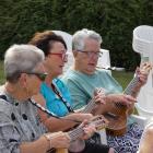 Alexandra women (from left) Judy Guise, Heather Trainor and Rosie Henderson play ukuleles at the...