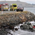 The car after it ended up in the sea near Deborah Bay, Dunedin, yesterday. PHOTO: LINDA ROBERTSON