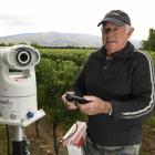 Viticulturist Barry Hunt with ‘‘Birdzout’’ auto bird scare laser to be used at Ewing Stevens’...