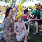 Enjoying the Mosgiel Party in the Park yesterday are (left) Shauney Macaskill and her daughter...