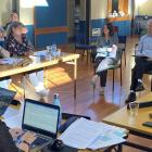 Members of the Waikouaiti Coast Community Board and public listen as (from left) medical officer...