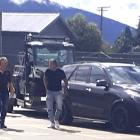Destiny Church leader Brian Tamaki (right) in a supermarket car park in Te Anau on Tuesday. PHOTO...