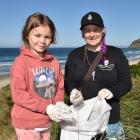 Piper and Chelsea McGaw take some time on a Saturday morning to collect rubbish left by other...