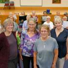 The Phoenix Singers' new interim conductor Claire Stevens (third from left), and three new...