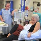 Dialysis nurse Leighanne Everett shares a joke with patient Karen Williamson. PHOTOS: CHRISTINE O...
