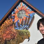 International street artist Koryu Aoshima with his kea creation at a former church in Hargest...