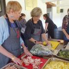 Food for Love volunteers at the Upper Clutha Rugby Football Club clubrooms prepare 200 meals to...