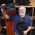 A Graduate Women Otago regalia convener, Walter Lawrence, holds trenchers as preparations...