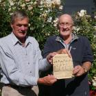 Wyllie’s Crossing Wanderers team mates Ross Stevens (left) and Peter Russell hold a newspaper...