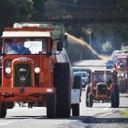 Steve Day leads the way for the Heartland Tractor Trek on the Dunedin Northern Motorway yesterday...