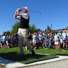 New Zealand golfing great Sir Bob Charles (85) plays the first shot off the first tee on the new...