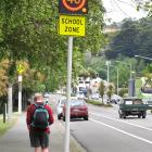 Electronic variable speed limit signs, like this one outside Kaikorai Valley College, are...