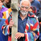 Stephen Macey, of Mosgiel, leads a group of about 30 people from church communities across the...