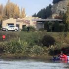 Wanaka Search and Rescue Swift Water team members and police retrieve the body of a man from the...