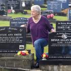 Dawn Smith was brightening up the graves of her daughter Kylie and husband Bevan at the Owaka...